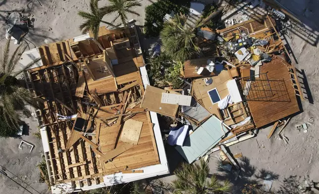 A house that was swept from its foundation lies broken open following the passage of Hurricane Milton, on Manasota Key, in Englewood, Fla., Sunday, Oct. 13, 2024. (AP Photo/Rebecca Blackwell)