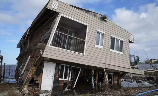 A house lies in ruins after sustaining tornado and flood damage from Hurricane Milton, Thursday, Oct. 10, 2024, in Matlacha, Fla. (AP Photo/Marta Lavandier)