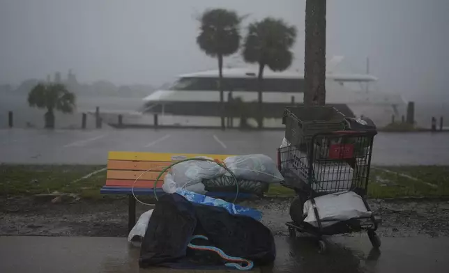 Personal items sit abandoned on the side of a road on Deadman Key, ahead of the arrival of Hurricane Milton, in South Pasadena, Fla., Wednesday, Oct. 9, 2024. (AP Photo/Rebecca Blackwell)