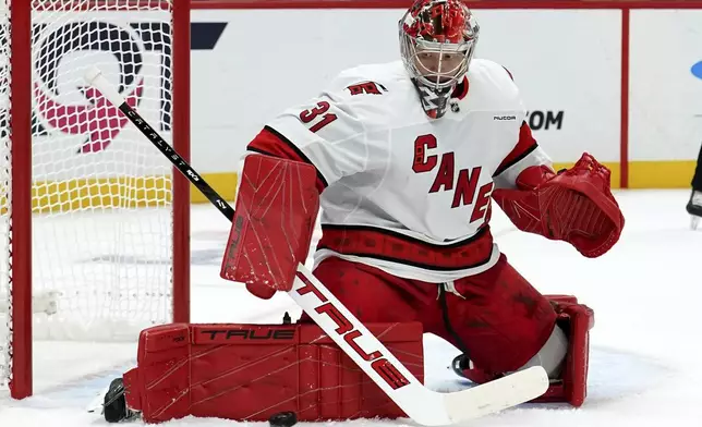 Carolina Hurricanes goaltender Frederik Andersen (31) makes a save during the second period of an NHL hockey game against the Pittsburgh Penguins, Friday, Oct. 18, 2024, in Pittsburgh. (AP Photo/Matt Freed)