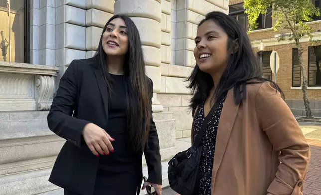 DACA-recipient María Rocha-Carrillo, 37, greets supporters outside federal appellate court in New Orleans on Thursday, Oct. 10, 2024. (AP Photo/Jack Brook)