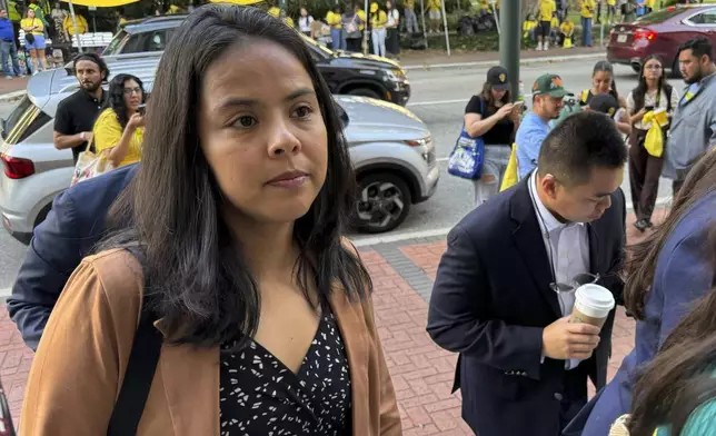 DACA-recipient María Rocha-Carrillo, 37, arrives in federal appellate court in New Orleans on Thursday, Oct. 10, 2024 to hear lawyers debate the future of the policy that has allowed her and hundreds of thousands of others to remain in the U.S. legally. (AP Photo/Jack Brook)