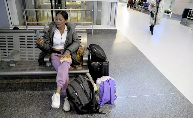 Sofia Roca, an immigrant from Colombia, prepares to leave Aurora, Colorado, on March 29, 2024. (AP Photo/Thomas Peipert)