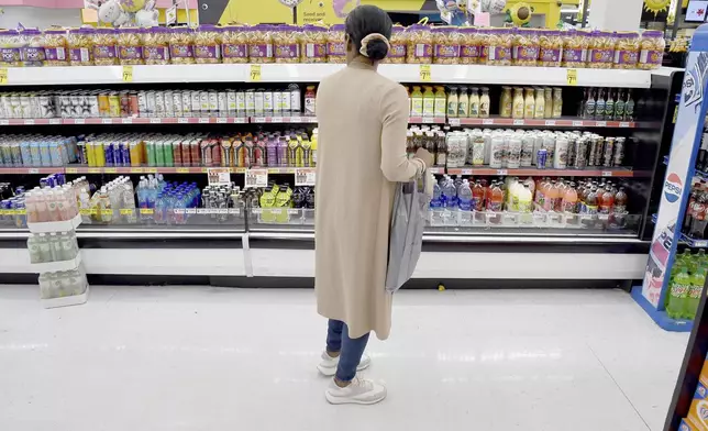 Sofia Roca shops on East Colfax Avenue in Aurora, Colorado, on March 29, 2024. (AP Photo/Thomas Peipert)