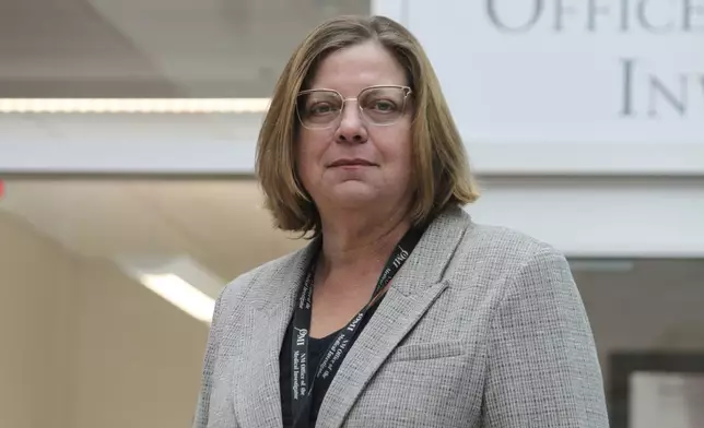 Forensic anthropologist Heather Edgar with the Office of the Medical Investigator poses for a portrait outside her office in Albuquerque, New Mexico, on Thursday, Oct. 3, 2024. (AP Photo/Susan Montoya Bryan)