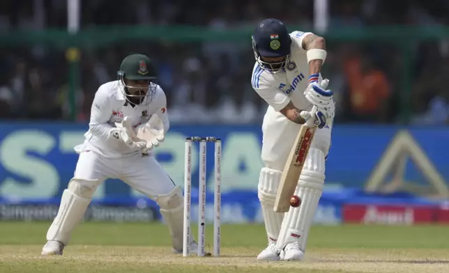 India's Virat Kohli plays a shot on the fifth and final day of the second cricket test match between Bangladesh and India in Kanpur, India, Tuesday, October 1, 2024. (AP Photo/Ajit Solanki)