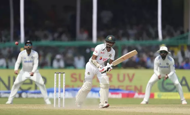 Bangladesh's Taijul Islam plays a shot on the fifth and final day of the second cricket test match between Bangladesh and India in Kanpur, India, Tuesday, October 1, 2024. (AP Photo/Ajit Solanki)