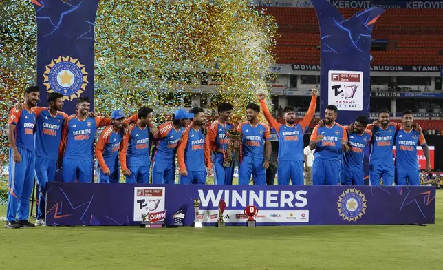 Indian players celebrate with the trophy after winning the T20 cricket series against Bangladesh in Hyderabad, India, Saturday, Oct. 12, 2024. (AP Photo/Mahesh Kumar A.)