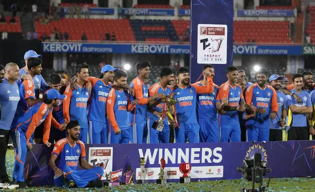 Indian players celebrate with the trophy after winning the T20 cricket series against Bangladesh in Hyderabad, India, Saturday, Oct. 12, 2024. (AP Photo/Mahesh Kumar A.)