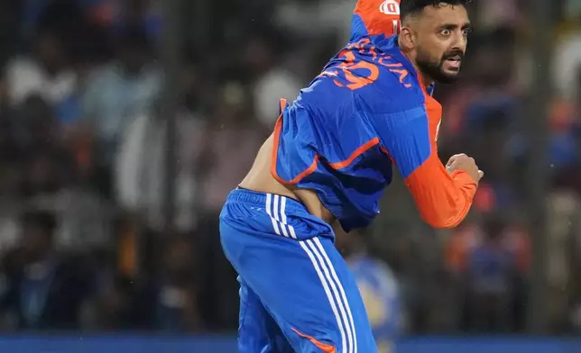 India's Varun Chakravarthy bowls a delivery during the first T20 cricket match between Bangladesh and India in Gwalior, India, Sunday, Oct. 6, 2024. (AP Photo/Manish Swarup)