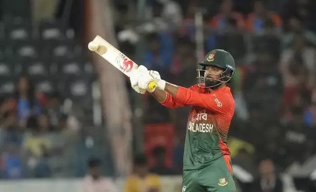 Bangladesh's Tawhid Hridoy plays a shot during the third and final T20 cricket match between Bangladesh and India in Hyderabad, India, Saturday, Oct. 12, 2024. (AP Photo/Mahesh Kumar A.)