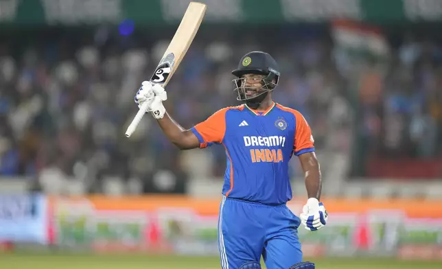 India's Sanju Samson acknowledges the crowd while walks back to the pavilion after losing his wicket to Bangladesh's Mustafizur Rahman during the third and final T20 cricket match between Bangladesh and India in Hyderabad, India, Saturday, Oct. 12, 2024. (AP Photo/Mahesh Kumar A.)