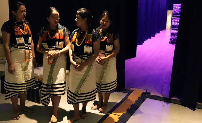 Artists from India's northeastern state of Nagaland wait backstage for their performance at the two-day Brillante Piano Festival in Bengaluru, India, Sunday, Sept. 29, 2024. (AP Photo/Aijaz Rahi)