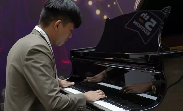 Takosangba Jamir, 27, a blind pianist, performs during the two-day Brillante Piano Festival in Bengaluru, India, Sunday, Sept. 29, 2024. (AP Photo/Aijaz Rahi)