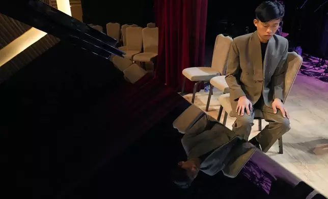 Takosangba Jamir, 27, a blind pianist, waits for his turn to rehearse during the two-day Brillante Piano Festival in Bengaluru, India, Sunday, Sept. 29, 2024. (AP Photo/Aijaz Rahi)