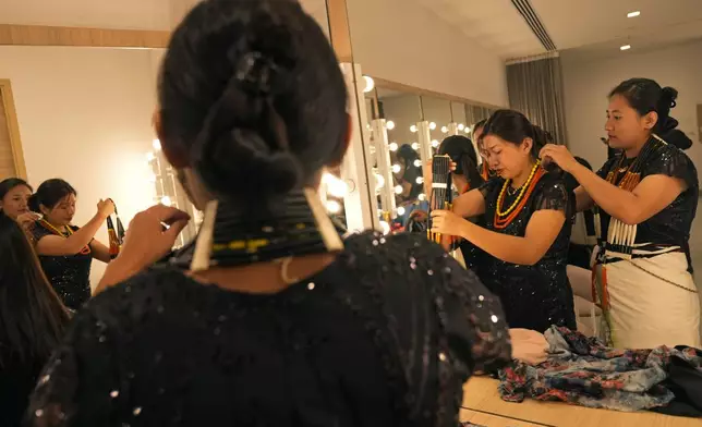 Artists from India's northeastern state of Nagaland prepare before a performance at the two-day Brillante Piano Festival in Bengaluru, India, Sunday, Sept. 29, 2024. (AP Photo/Aijaz Rahi)