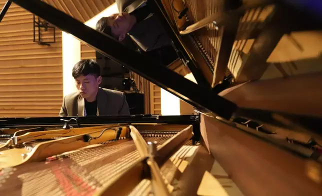 Takosangba Jamir, 27, a blind pianist, rehearses during the two-day Brillante Piano Festival in Bengaluru, India, Sunday, Sept. 29, 2024. (AP Photo/Aijaz Rahi)