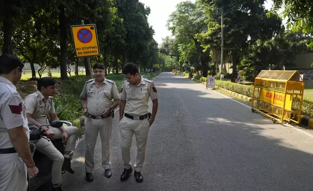 Policemen guard a road leading to the Canadian high commission in New Delhi, India, Tuesday, Oct. 15, 2024 after India and Canada expelled each other’s top diplomats over an ongoing dispute about the killing of a Sikh activist in Canada. (AP Photo/Manish Swarup)