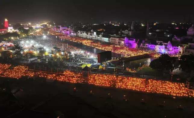 A record 2.51 million earthen oil lamps are lit along the Saryu river during Deepotsav celebrations on the eve of Diwali, creating a new Guinness World Record, in Ayodhya, India, Wednesday, Oct. 30, 2024. (AP Photo/Rajesh Kumar Singh)