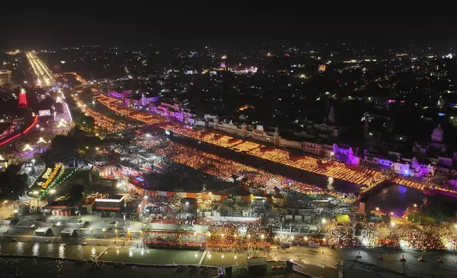 A record 2.51 million earthen oil lamps are lit along the Saryu river during Deepotsav celebrations on the eve of Diwali, creating a new Guinness World Record, in Ayodhya, India, Wednesday, Oct. 30, 2024. (AP Photo/Rajesh Kumar Singh)