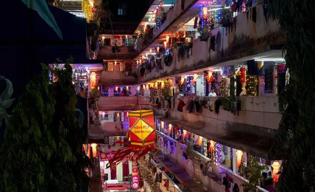 FILE- A residential building is decorated with lanterns and lights during Diwali, the festival of lights in Mumbai, India, Nov. 12, 2023. (AP Photo/Rafiq Maqbool, File)