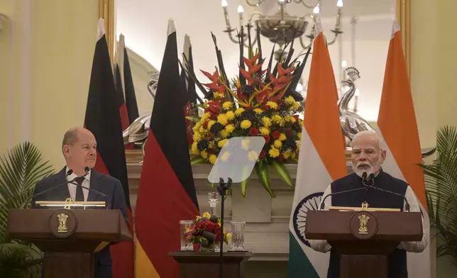 Indian Prime Minister Narendra Modi, right, and German Chancellor Olaf Scholz speak after bilateral talks in New Delhi, India, Friday, Oct. 25, 2024. (AP Photo)