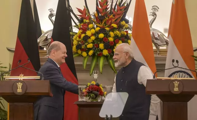 Indian Prime Minister Narendra Modi, right, and German Chancellor Olaf Scholz, shake hands after bilateral talks in New Delhi, India, Friday, Oct. 25, 2024. (AP Photo)