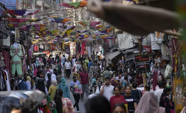 People crowd a market area on the eve of Diwali, the Hindu festival of lights, in Jammu, India, Wednesday, Oct.30,2024. Diwali is one of Hinduism's most important festivals, dedicated to the worship of the goddess of wealth Lakshmi. (AP Photo/Channi Anand)