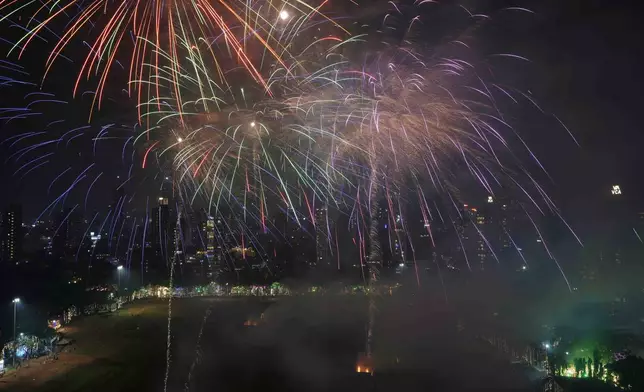 Fire crackers and smoke fill the city skyline as a part of Diwali celebrations at Shivaji Park in Mumbai, India, Wednesday, Oct. 30, 2024.(AP Photo/Rajanish Kakade)