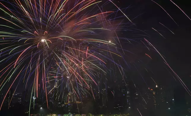 Fire crackers and smoke fill the city skyline as a part of Diwali celebrations at Shivaji Park in Mumbai, India, Wednesday, Oct. 30, 2024.(AP Photo/Rajanish Kakade)