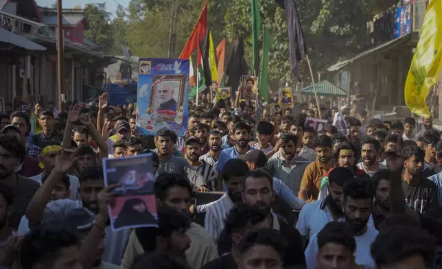 Kashmiri Shiite Muslims shout pro-Palestine and anti-Israel slogans during a protest in solidarity with Palestinians and against the killing of Hezbollah leader Hassan Nasrallah, at Mirgund north village of Srinagar, Indian controlled Kashmir, Friday, Oct. 4, 2024. (AP Photo/Mukhtar Khan)