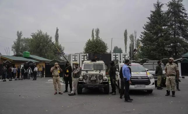 Indian police guard outside a vote counting center for the recent election on the outskirts of Srinagar, Indian controlled Kashmir, Tuesday, Oct. 8, 2024. (AP Photo/Mukhtar Khan)