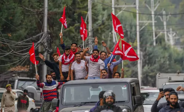 Supporters of National Conference party shout slogans as they celebrate early leads in the election for a local government in Indian controlled Kashmir, Srinagar, Tuesday, Oct. 8, 2024. (AP Photo/Dar Yasin)