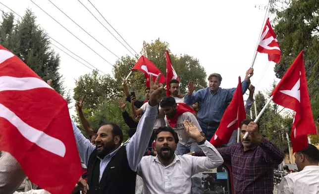 Supporters of National Conference party shout slogans as they celebrate early leads in the election for a local government in Indian controlled Kashmir, Srinagar, Tuesday, Oct. 8, 2024. (AP Photo/Dar Yasin)