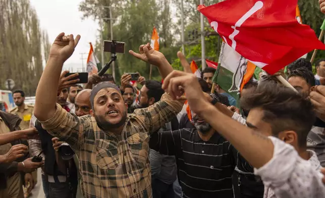 Supporters of National Conference party shout slogans as they celebrate early leads in the election for a local government in Indian controlled Kashmir, Srinagar, Tuesday, Oct. 8, 2024. (AP Photo/Dar Yasin)