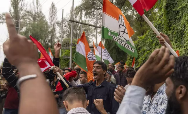 Supporters of National Conference party shout slogans as they celebrate early leads in the election for a local government in Indian controlled Kashmir, Srinagar, Tuesday, Oct. 8, 2024. (AP Photo/Dar Yasin)