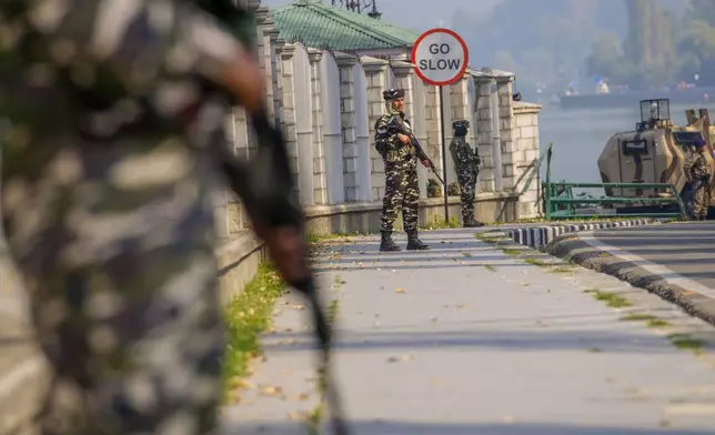 Paramilitary soldiers stand guard outside the venue of swearing in ceremony of ministers of Kashmir's local government on the outskirts of Srinagar, Indian controlled Kashmir, Wednesday, Oct. 16, 2024. (AP Photo/Dar Yasin)