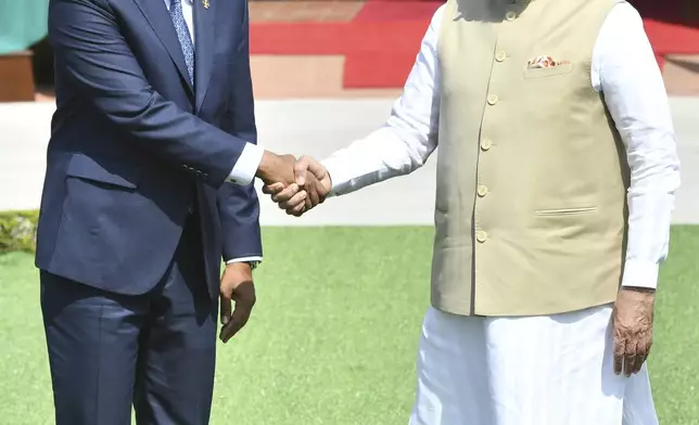 Indian Prime Minister Narendra Modi, right, and Maldives President Mohamed Muizzu shake hands before their delegation level meeting in New Delhi, India, Monday, Oct. 7, 2024.(AP Photo)