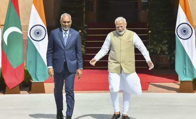 Indian Prime Minister Narendra Modi, right, walks with Maldives President Mohamed Muizzu before their delegation level meeting in New Delhi, India, Monday, Oct. 7, 2024.(AP Photo)