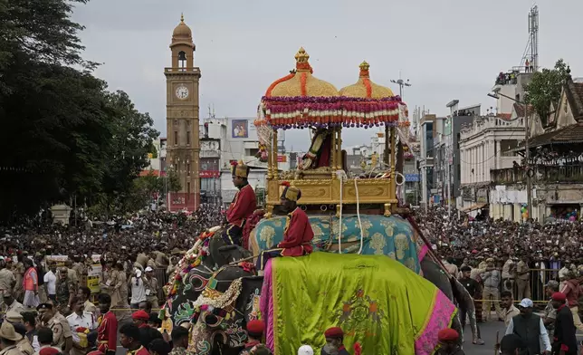 Abhimanyu, a 58-year-old elephant, carries on its back an idol of Chamundeshwari, the Hindu goddess also known as Durga, in a golden howdah, during a procession on the last day of Hindu festival Dusshera, in Mysuru, India, Saturday, Oct. 12, 2024. (AP Photo/Aijaz Rahi)