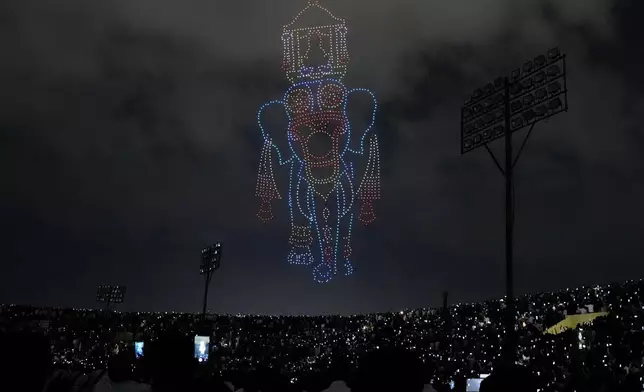 Drones fly to create an image of an elephant during a cultural show as part of the Dussehra festivities, in Mysuru, India, Friday, Oct. 11, 2024. (AP Photo/Aijaz Rahi)