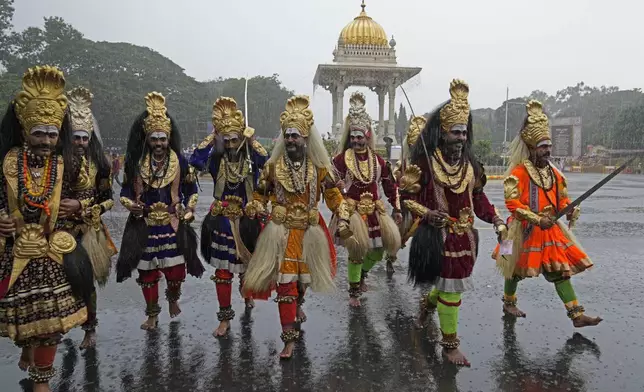 Indian artists perform during a procession on the last day of the Dussehra festivities, in Mysuru, India, Saturday, Oct. 12, 2024. (AP Photo/Aijaz Rahi)