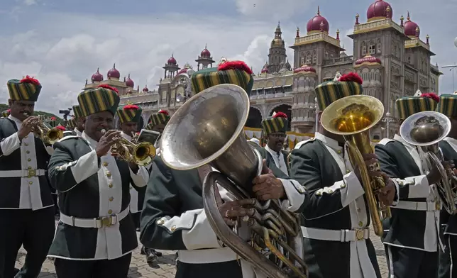 A musical band performs in front of Amba Palace during a procession on the last day of the Dussehra festivities, in Mysuru, India, Saturday, Oct. 12, 2024. (AP Photo/Aijaz Rahi)