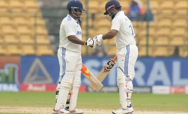 India's Sarfaraz Khan, left, and Rishabh Pant encourage each other during the day four of the first cricket test match between India and New Zealand at the M.Chinnaswamy Stadium, in Bengaluru, India, Saturday, Oct. 19, 2024. (AP Photo/Aijaz Rahi)