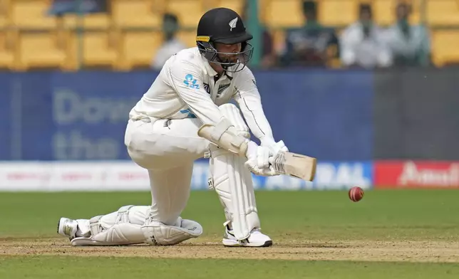 New Zealand's Devon Conway plays a shot during the day two of the first cricket test match between India and New Zealand at the M.Chinnaswamy Stadium, in Bengaluru, India, Thursday, Oct. 17, 2024. (AP Photo/Aijaz Rahi)