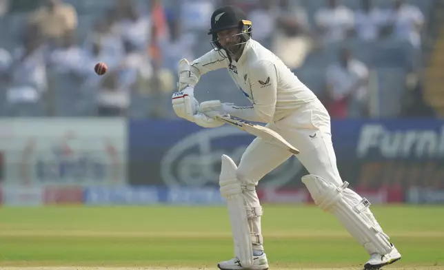 New Zealand's Devon Conway plays a shot during the day one of the second cricket test match between India and New Zealand at the Maharashtra Cricket Association Stadium , in Pune, India, Thursday, Oct. 24, 2024. (AP Photo/Rafiq Maqbool)