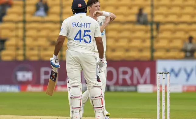 New Zealand's Matt Henry gestures to ask for a review for the wicket of India's captain Rohit Sharma during the day two of the first cricket test match between India and New Zealand at the M.Chinnaswamy Stadium, in Bengaluru, India, Thursday, Oct. 17, 2024. (AP Photo/Aijaz Rahi)