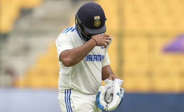 India's captain Rohit Sharma reacts as he walks off the field after losing his wicket during the day two of the first cricket test match between India and New Zealand at the M.Chinnaswamy Stadium, in Bengaluru, India, Thursday, Oct. 17, 2024. (AP Photo/Aijaz Rahi)