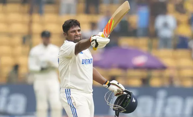 India's Sarfaraz Khan celebrates after scoring a century during the day four of the first cricket test match between India and New Zealand at the M.Chinnaswamy Stadium, in Bengaluru, India, Saturday, Oct. 19, 2024. (AP Photo/Aijaz Rahi)