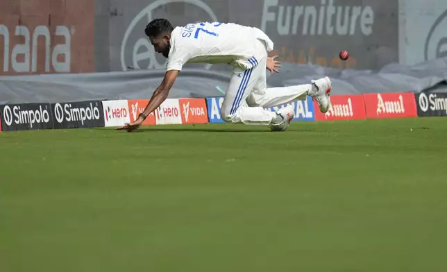 India's Mohammad Siraj fields the ball to save a boundary during the day three of the first cricket test match between India and New Zealand at the M.Chinnaswamy Stadium, in Bengaluru, India, Friday, Oct. 18, 2024. (AP Photo/Aijaz Rahi)